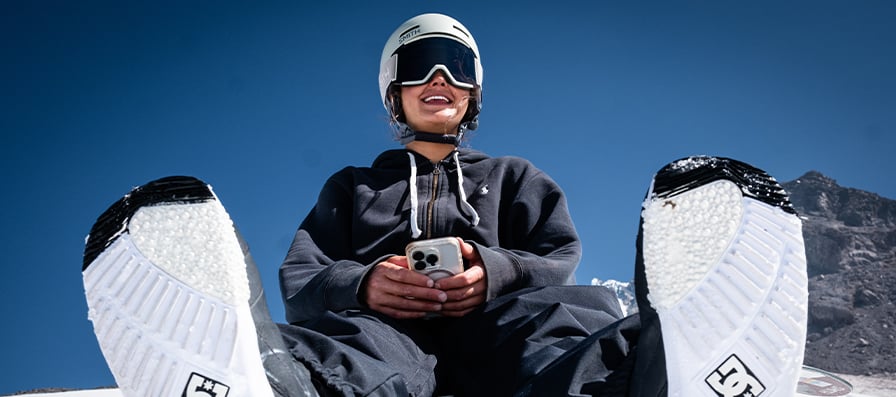 Snowboarder wearing Smith Squad Low Bridge Fit goggles