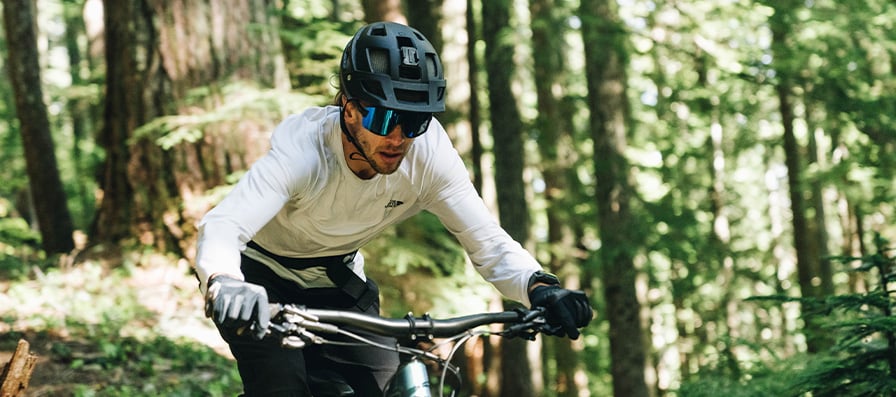 Mountain biker wearing Smith Wildcat sunglasses and Forefront 2 helmet