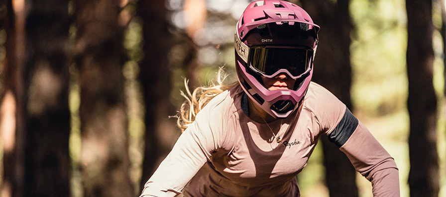 Mountain biker wearing Mainline helmet and Rhythm MTB Goggles